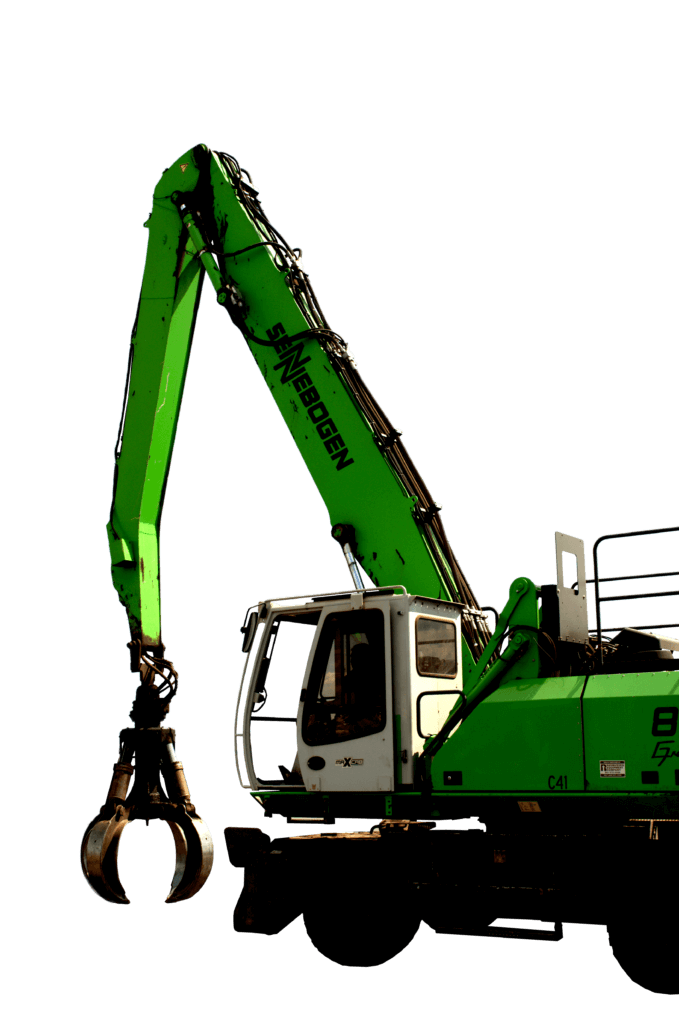 Machine in green color operating on metal debris. Commercial Scrap Metals Recycling On Site Cleanup