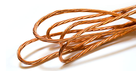 Copper wire coil on white background.