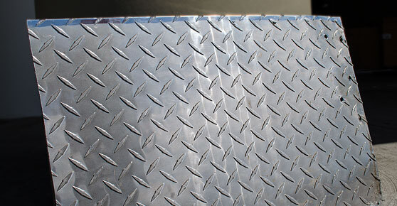 A metal sheet with a diamond pattern design.