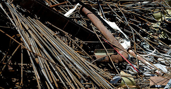 A heap of metal and scrap metal piled together, forming a disorganized collection of discarded materials.