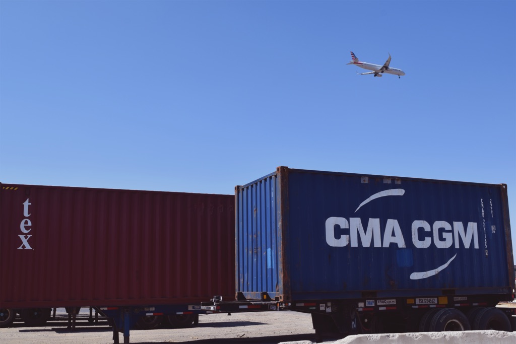 A truck carrying a container, ready for transportation.